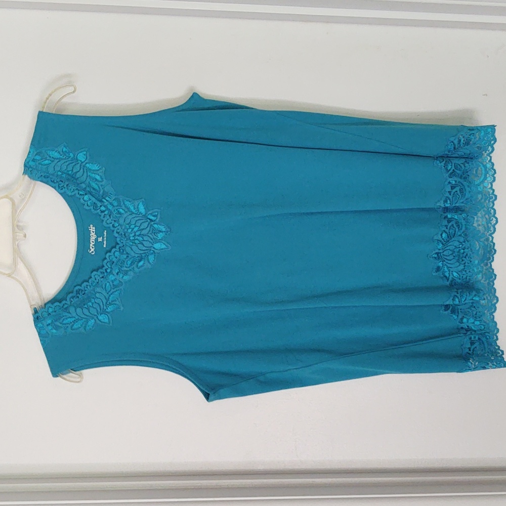 Blue Serengeti extra large shirt intricate lacing on neck and bottom of skirt